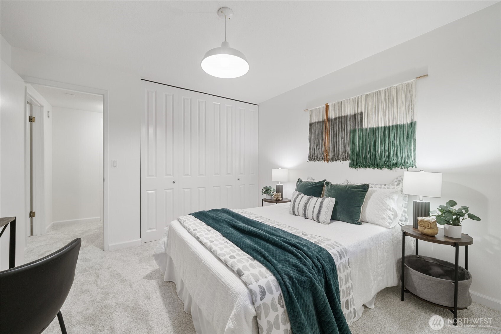 4545 Sand Point Way Northeast, Unit 203 Seattle, WA 98105 - Photo 17 of 28 a bedroom with a bed and a couch