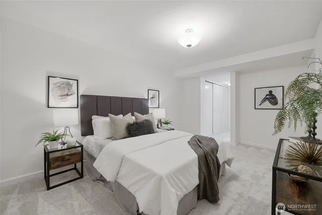 a bedroom with bed and a couch