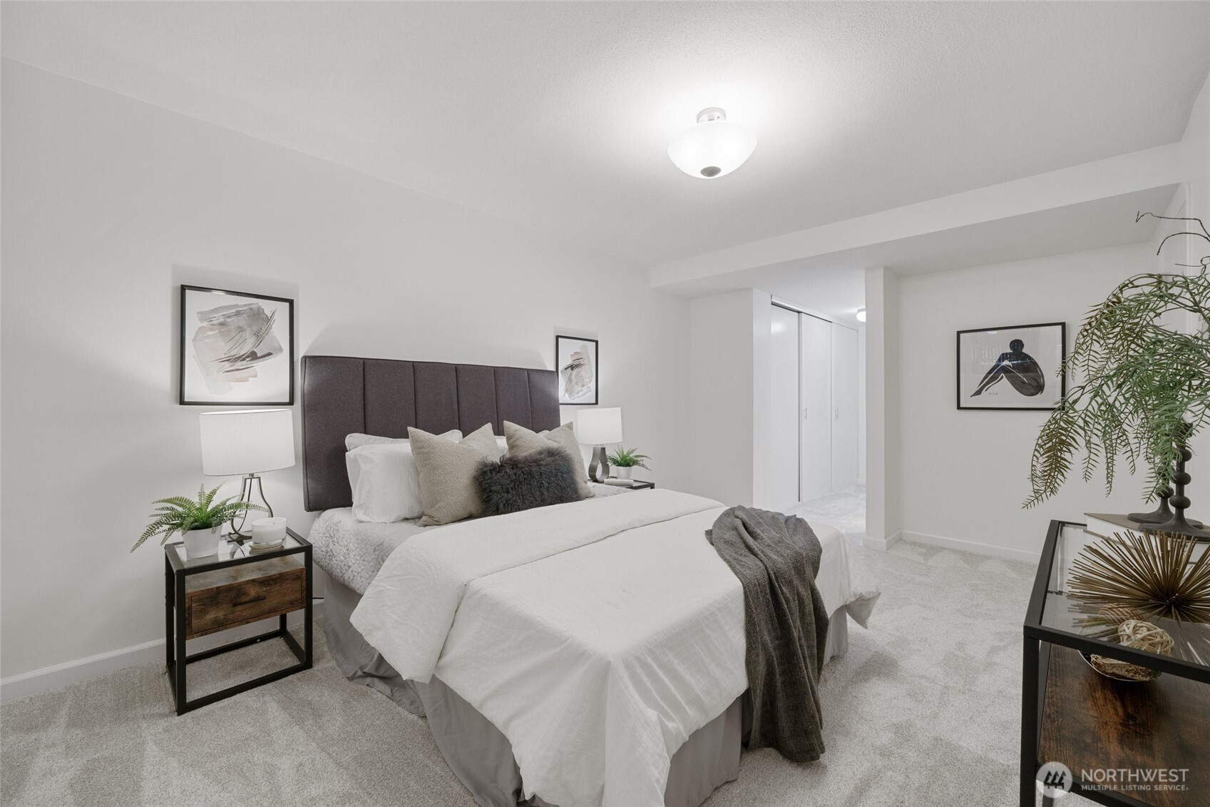 4545 Sand Point Way Northeast, Unit 203 Seattle, WA 98105 - Photo 20 of 28 a bedroom with bed and a couch