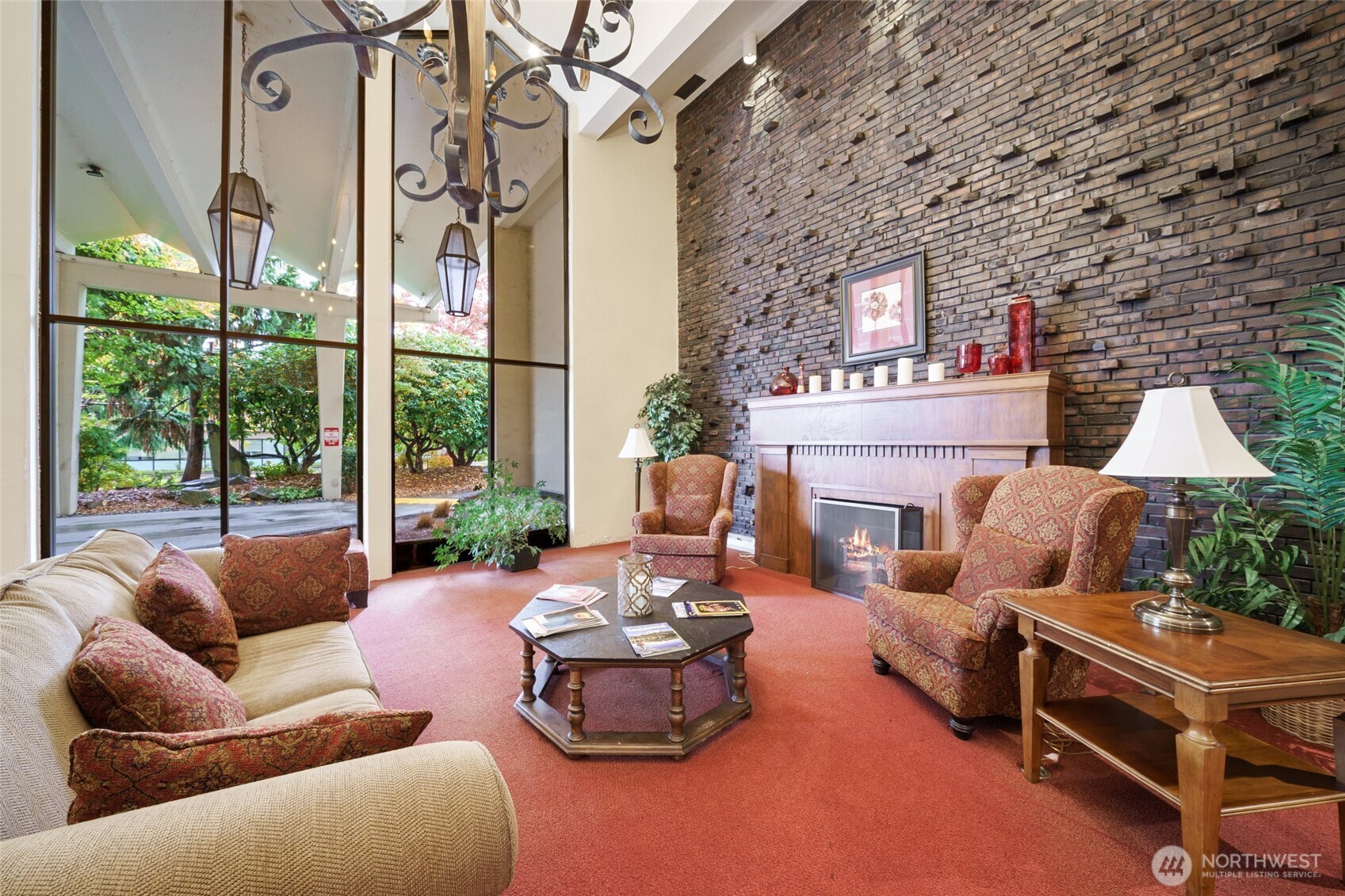 4545 Sand Point Way Northeast, Unit 203 Seattle, WA 98105 - Photo 24 of 28 a living room with furniture a fireplace and a large window
