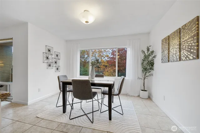 a view of a dining room with furniture window and outside view