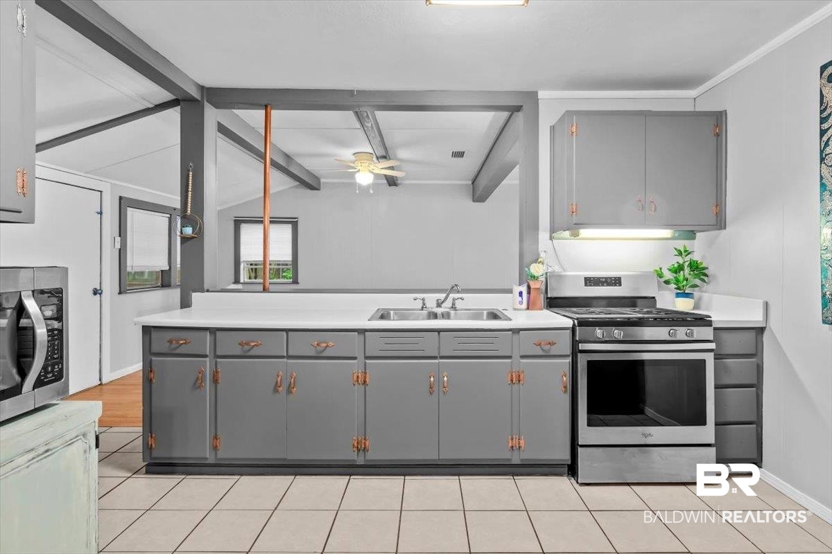 4918 Quimby Drive Mobile, AL 36619 - Photo 7 of 38 Kitchen with stainless steel appliances, gray cabinets, a sink, ceiling fan, and light countertops