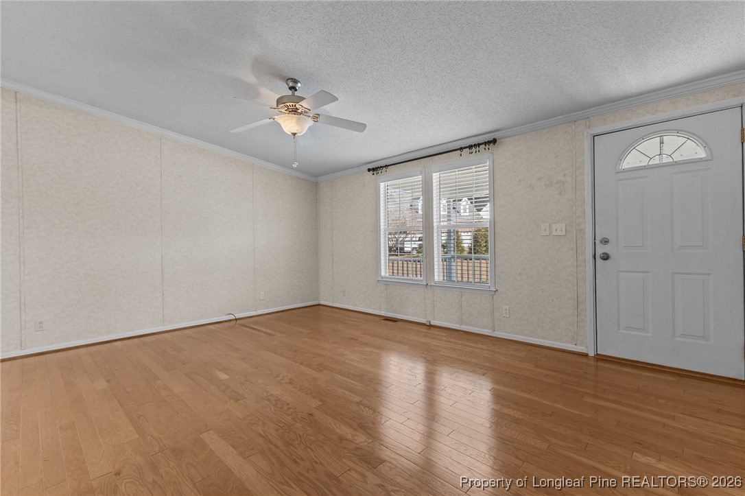 355 Rock Hill Road Fayetteville, NC 28312 - Photo 14 of 38 a view of an empty room with wooden floor and a window