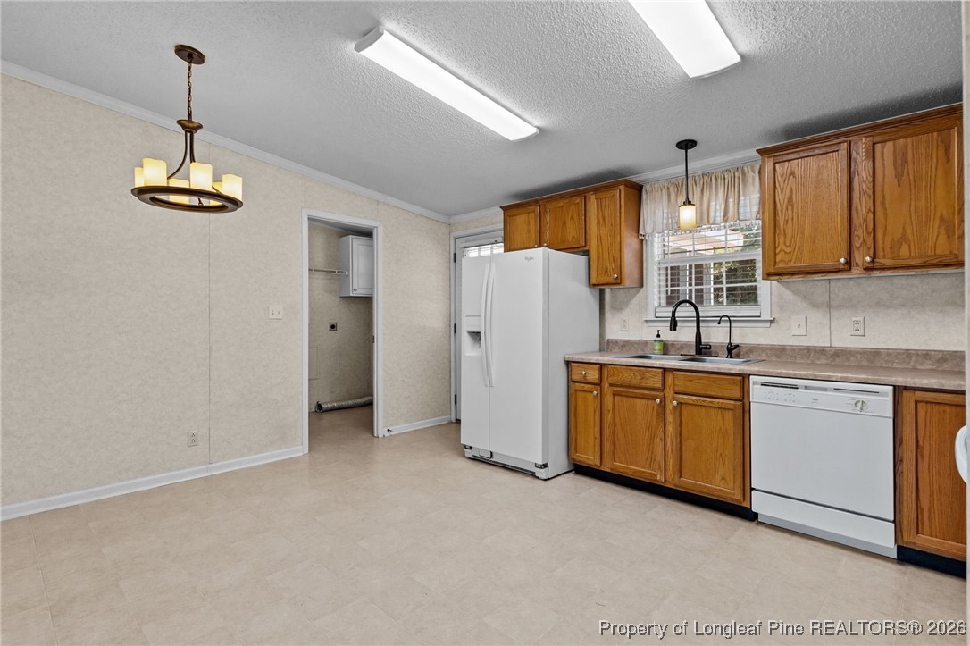 355 Rock Hill Road Fayetteville, NC 28312 - Photo 15 of 38 a kitchen with refrigerator and window