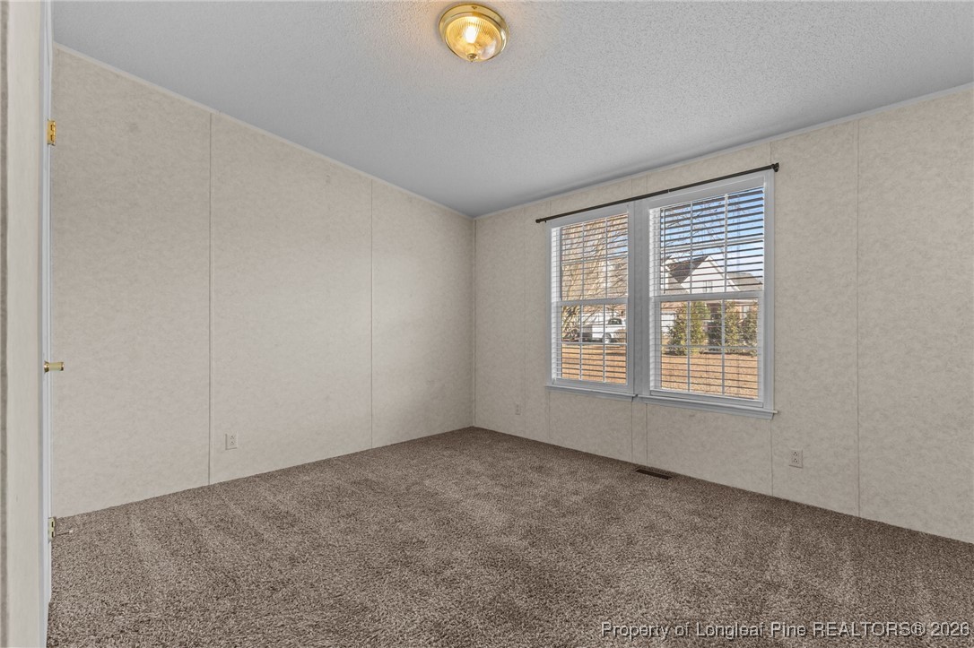 355 Rock Hill Road Fayetteville, NC 28312 - Photo 28 of 38 a view of an empty room with a window
