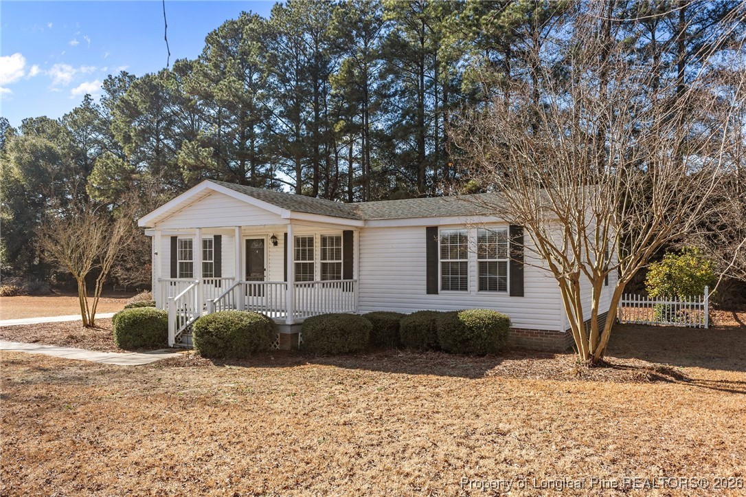 355 Rock Hill Road Fayetteville, NC 28312 - Photo 5 of 38 a front view of a house with a yard