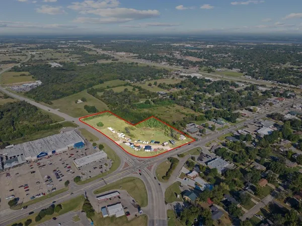 an aerial view of a residential houses with outdoor space