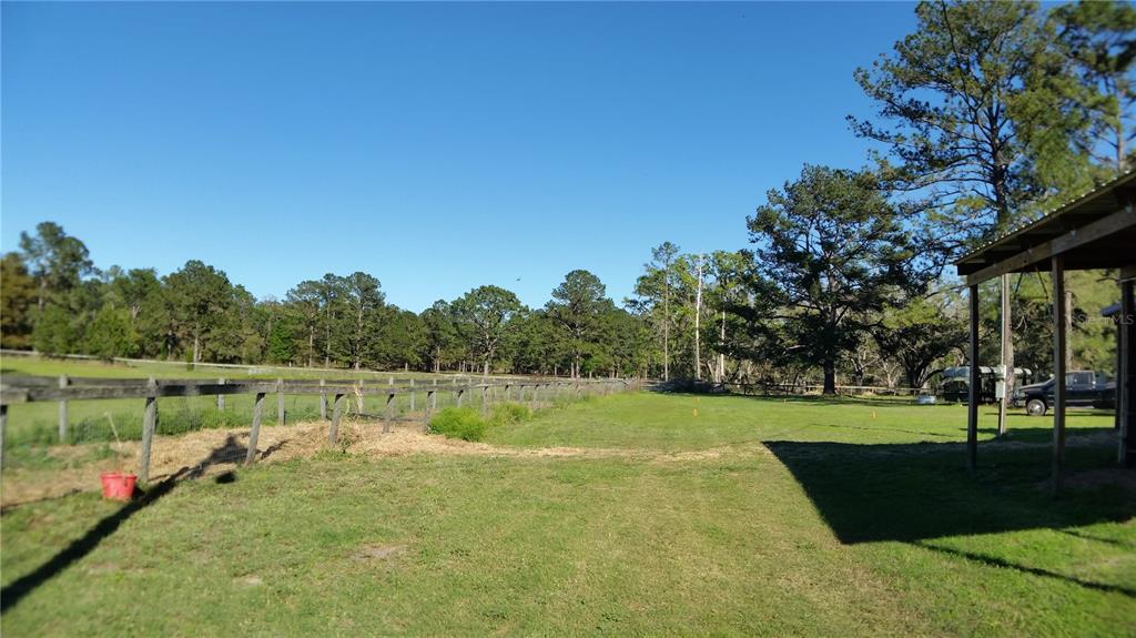 18635 Phillips Road Brooksville, FL 34604 - Photo 6 of 18 a view of a golf course with a lake view