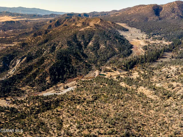 a view of mountain view with mountains in the background