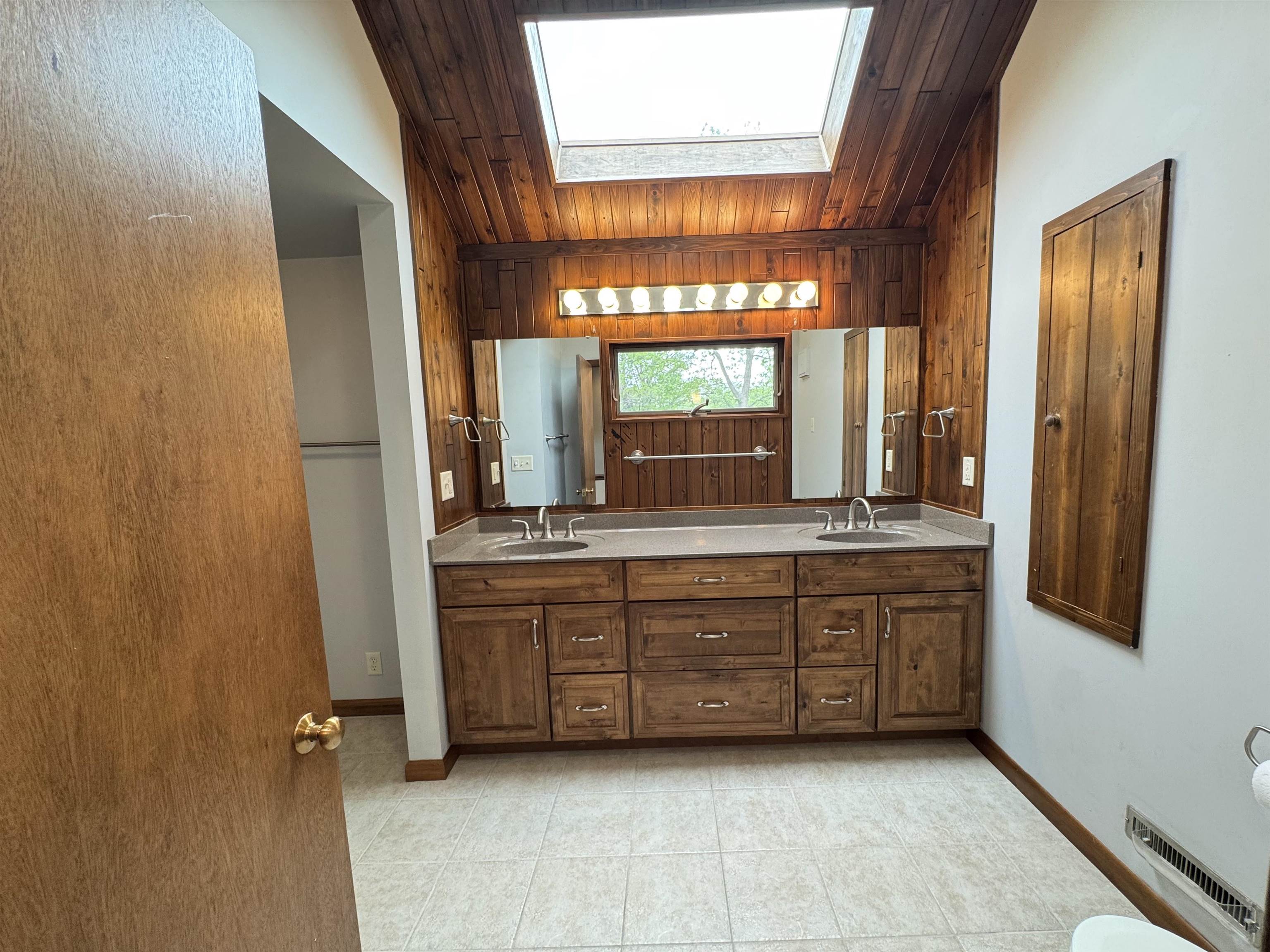 25303 Spring Valley Road Shannon, IL 61078 - Photo 21 of 22 a bathroom with a double vanity sink and mirror