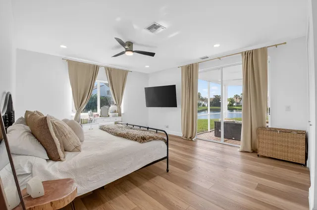 a large kitchen with a table and chairs