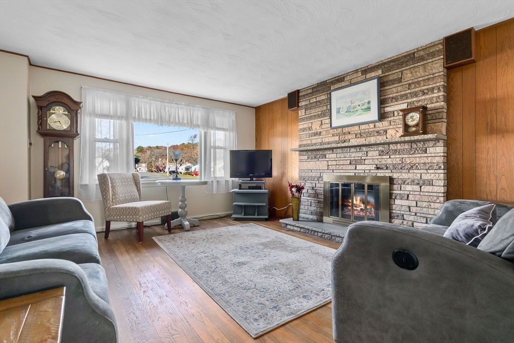 1 Robert Road Danvers, MA 01923 - Photo 12 of 39 a living room with furniture and a fireplace