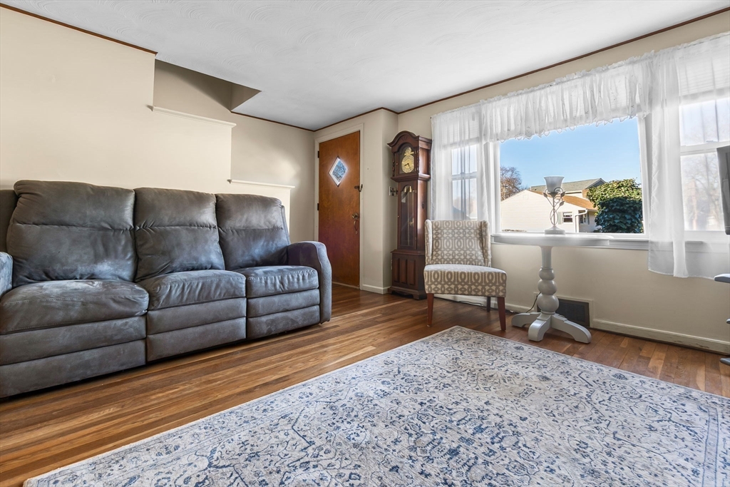 1 Robert Road Danvers, MA 01923 - Photo 13 of 39 a living room with furniture and a table