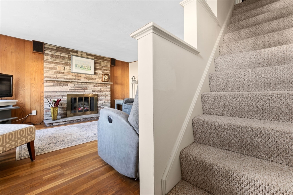1 Robert Road Danvers, MA 01923 - Photo 15 of 39 a living room with furniture and a fireplace