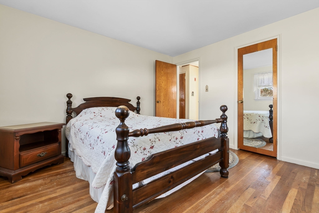 1 Robert Road Danvers, MA 01923 - Photo 17 of 39 a bedroom with a bed and wooden floor
