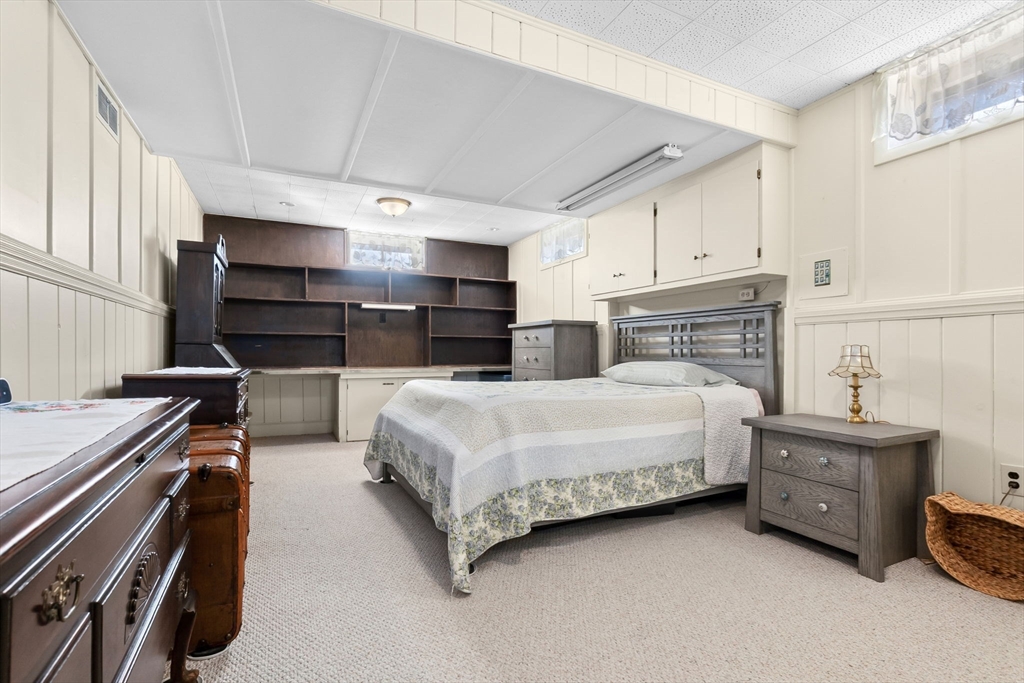 1 Robert Road Danvers, MA 01923 - Photo 25 of 39 a bedroom with a bed and a cabinets