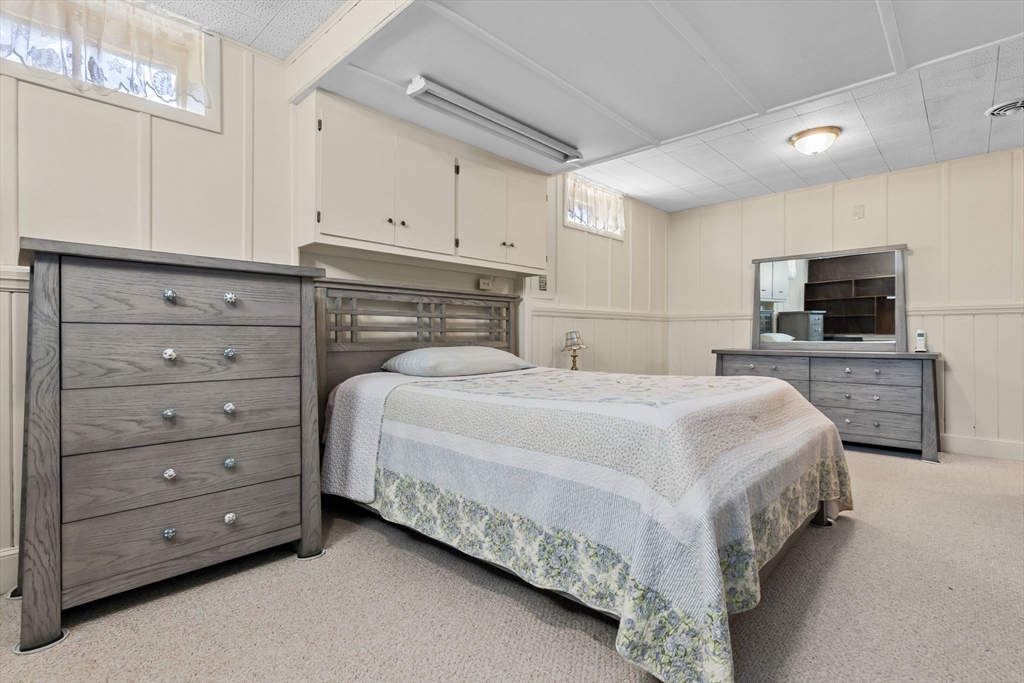 1 Robert Road Danvers, MA 01923 - Photo 26 of 39 a bedroom with a bed and a flat screen tv