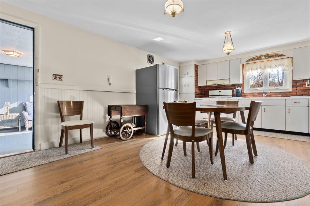 1 Robert Road Danvers, MA 01923 - Photo 7 of 39 a dining room with furniture and a kitchen view