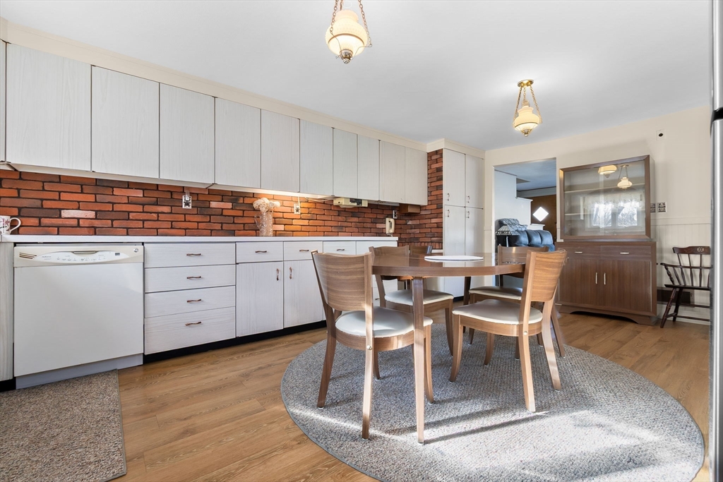1 Robert Road Danvers, MA 01923 - Photo 9 of 39 a dining table with chairs and chandelier