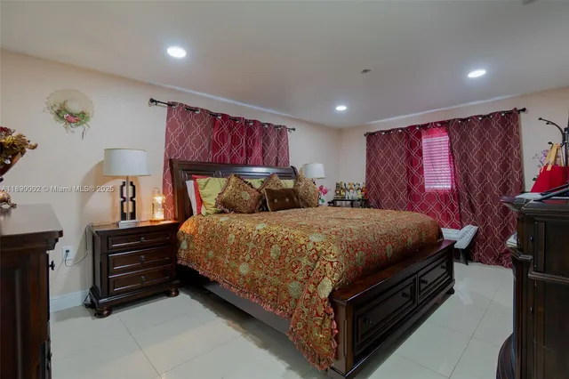 a bed sitting in a room next to a window