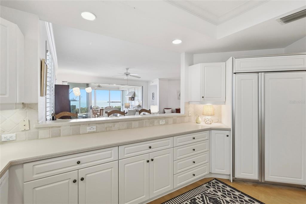 831 Harborshore Drive, Unit 1 Boca Grande, FL 33921 - Photo 11 of 81 a view of cabinets a sink and a window in a room
