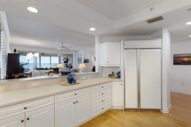 a view of a dining hall with lots of tables and chairs