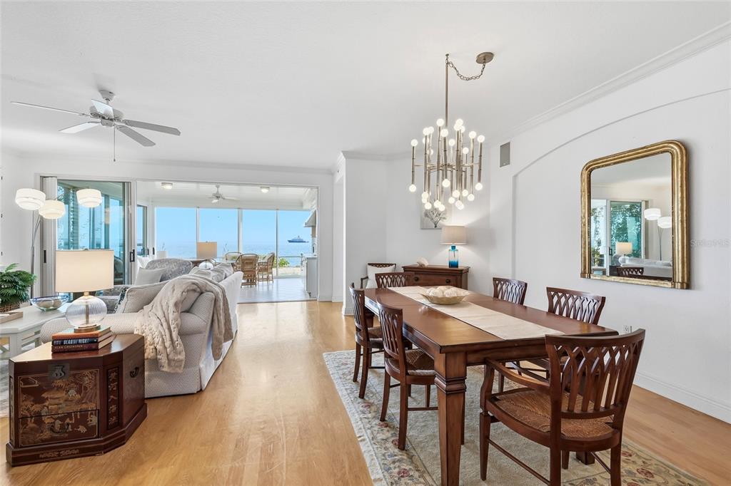 831 Harborshore Drive, Unit 1 Boca Grande, FL 33921 - Photo 13 of 81 a view of a dining room with furniture and wooden floor