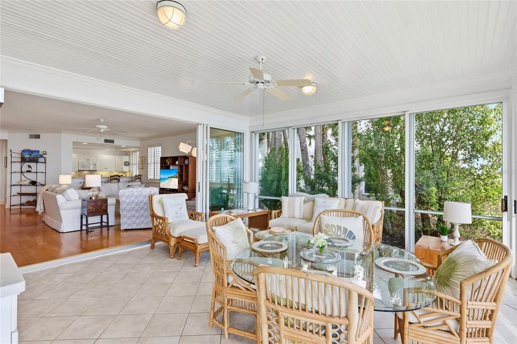 831 Harborshore Drive, Unit 1 Boca Grande, FL 33921 - Photo 21 of 81 a living room with furniture and a large window