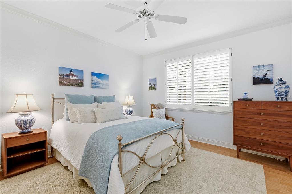 831 Harborshore Drive, Unit 1 Boca Grande, FL 33921 - Photo 29 of 81 a bedroom with a bed and a window