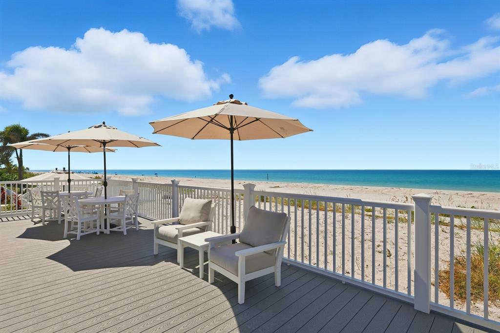 831 Harborshore Drive, Unit 1 Boca Grande, FL 33921 - Photo 45 of 81 a view of balcony and patio with wooden floor