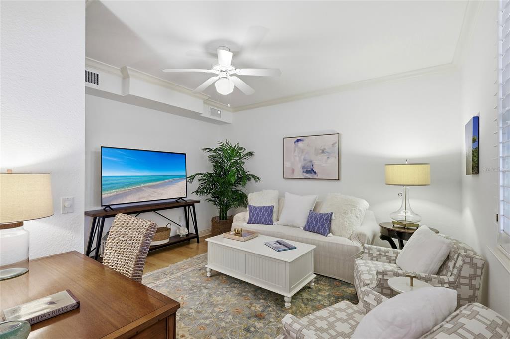 831 Harborshore Drive, Unit 1 Boca Grande, FL 33921 - Photo 5 of 81 a living room with furniture and a lamp