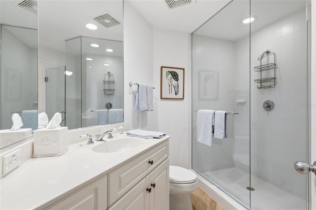 831 Harborshore Drive, Unit 1 Boca Grande, FL 33921 - Photo 7 of 81 a bathroom with a sink a toilet and shower