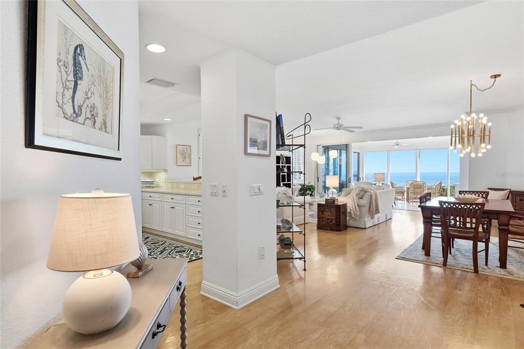 831 Harborshore Drive, Unit 1 Boca Grande, FL 33921 - Photo 8 of 81 a living room with furniture a dining table and a chandelier