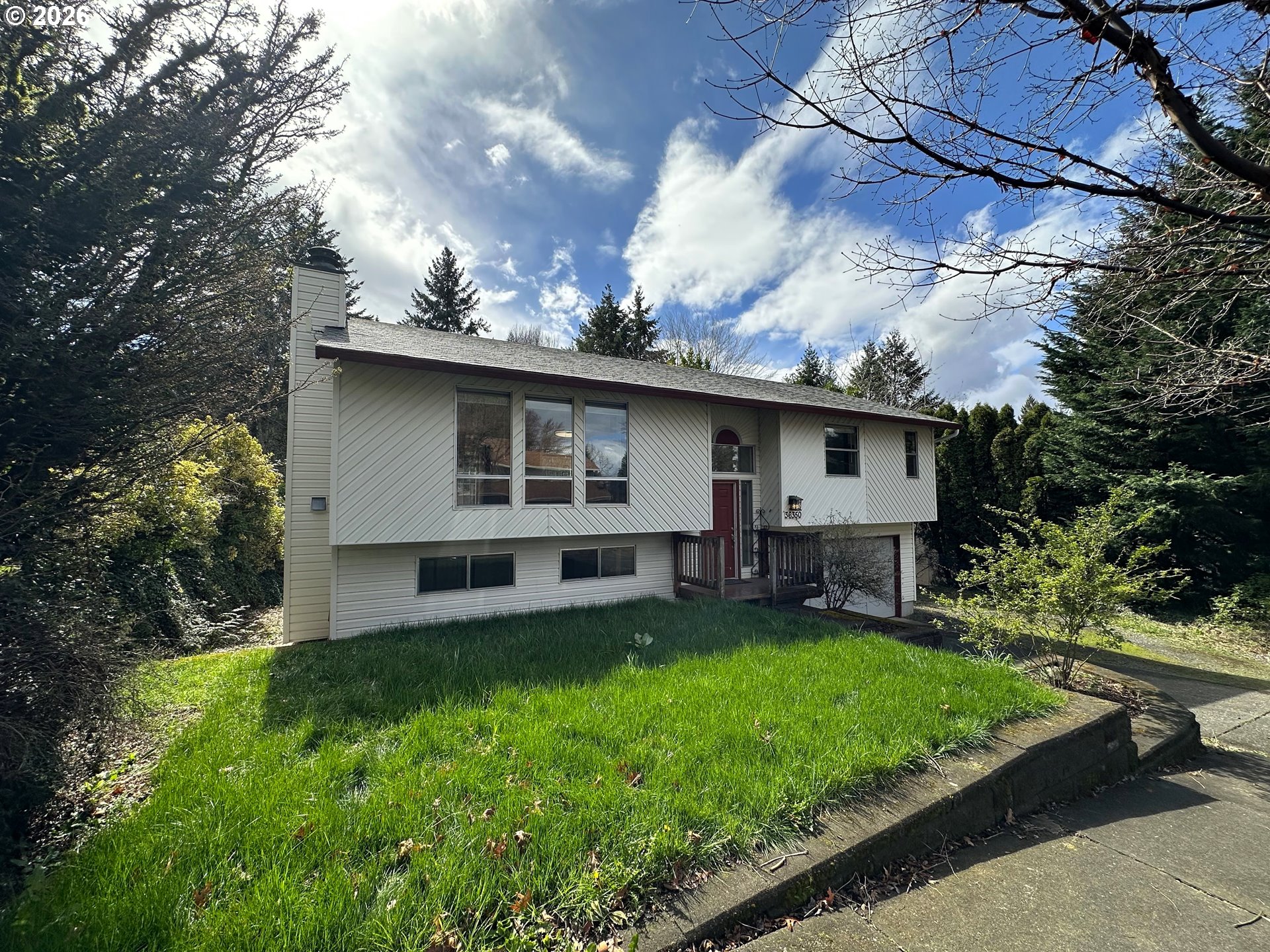 36350 Dubarko Road Sandy, OR 97055 - Photo 2 of 33 a view of a house with a yard fire pit and a large tree