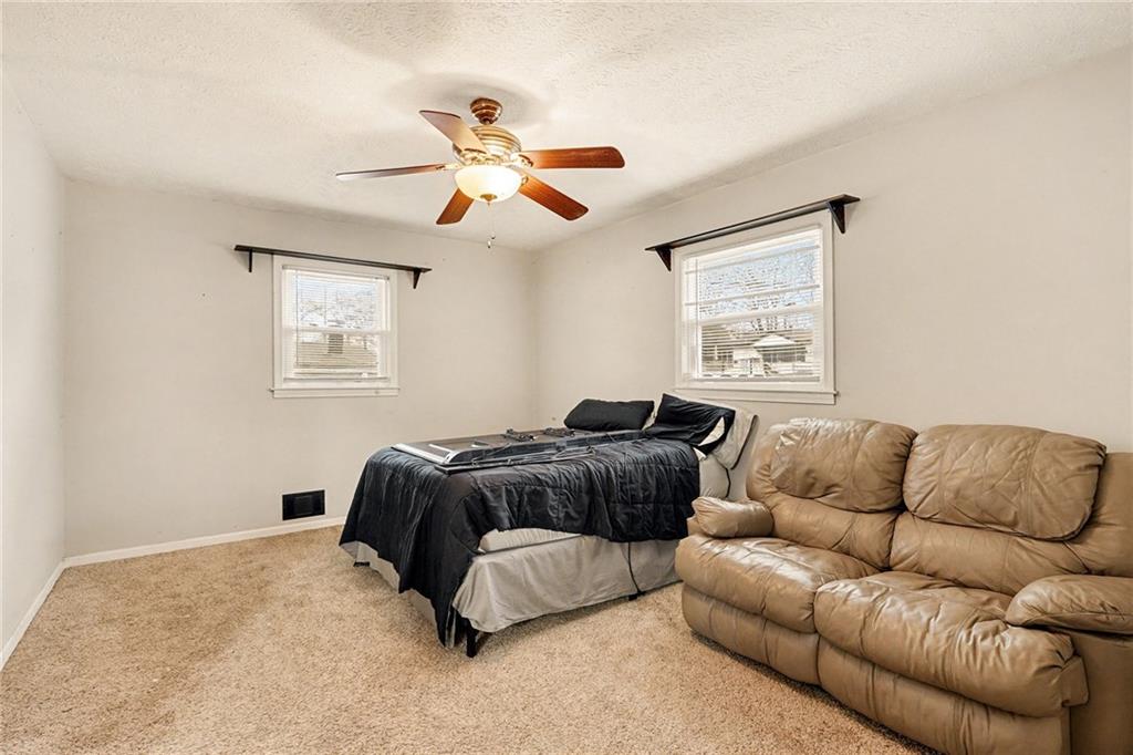 1995 Matt Drive Austell, GA 30168 - Photo 22 of 34 a living room with furniture ceiling fan and a window