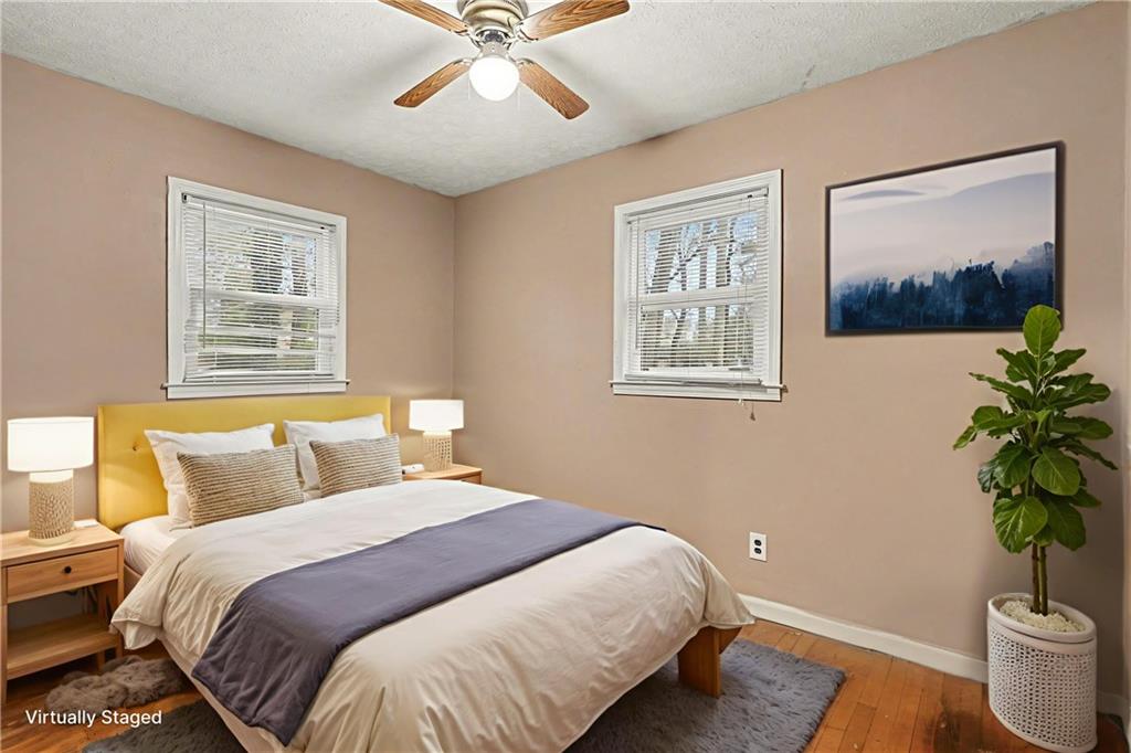 1995 Matt Drive Austell, GA 30168 - Photo 24 of 34 a bedroom with a large bed and a potted plant