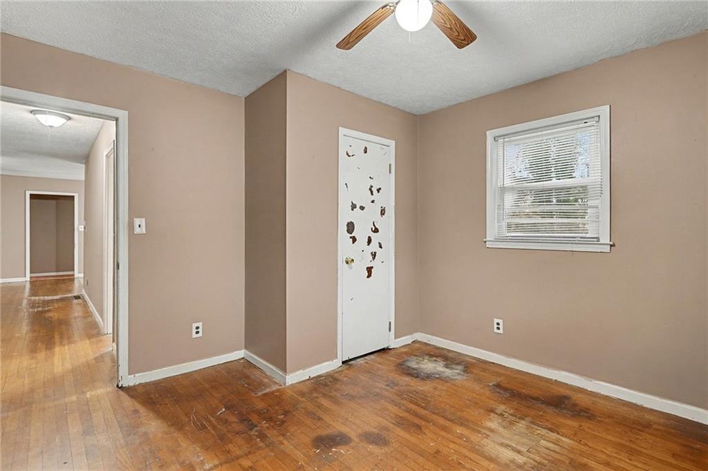1995 Matt Drive Austell, GA 30168 - Photo 26 of 34 an empty room with wooden floor and windows