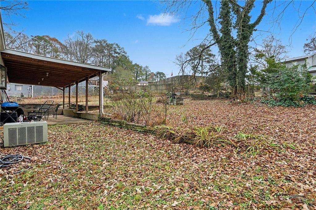 1995 Matt Drive Austell, GA 30168 - Photo 33 of 34 a backyard of a house with lots of green space