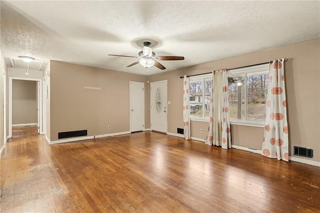 1995 Matt Drive Austell, GA 30168 - Photo 8 of 34 a view of an empty room with a window and wooden floor