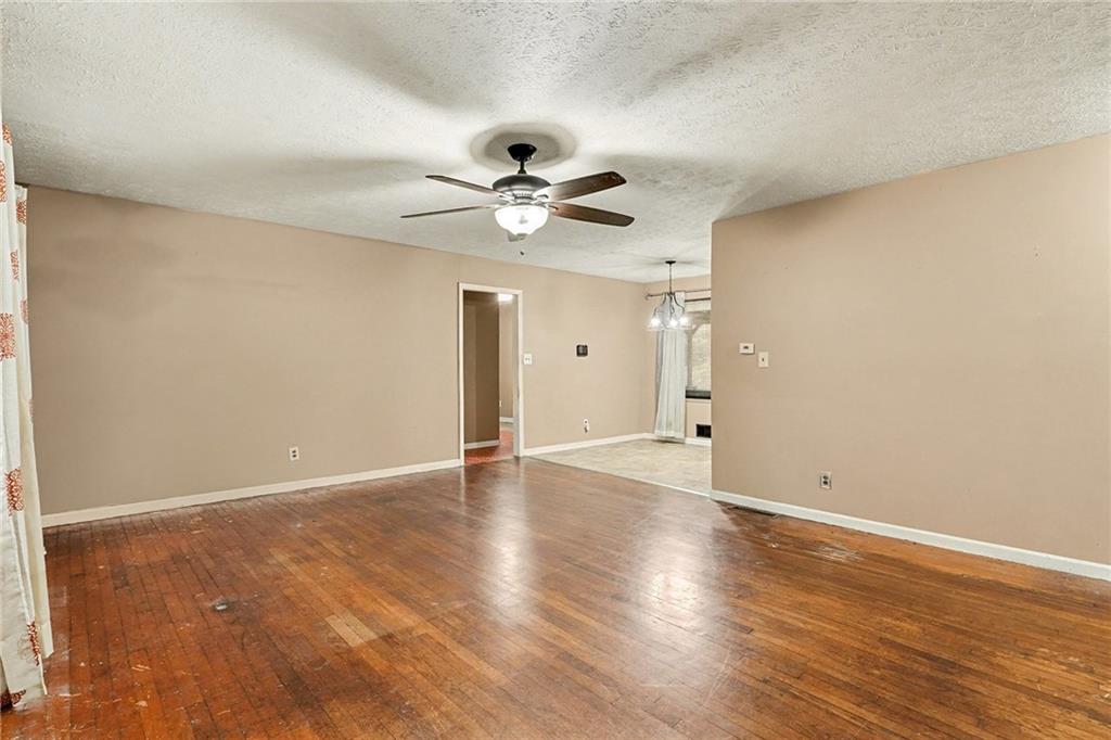 1995 Matt Drive Austell, GA 30168 - Photo 9 of 34 a view of an empty room with window and wooden floor