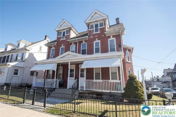 a front view of a house with a porch