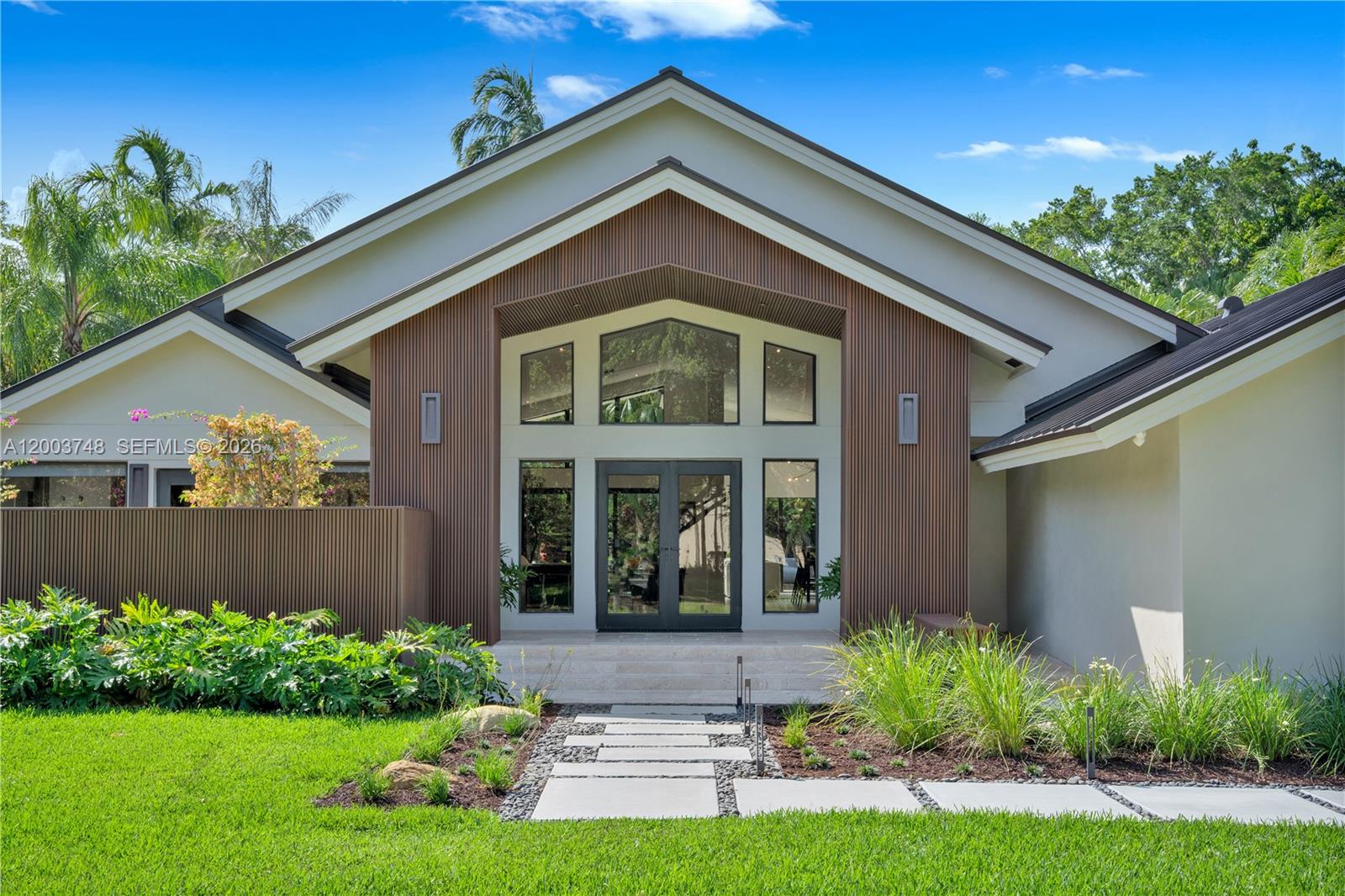 2675 Hackney Road Weston, FL 33331 - Photo 3 of 61 a front view of a house with a yard