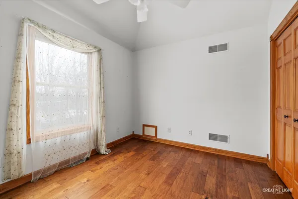 a view of an entryway with wooden floor