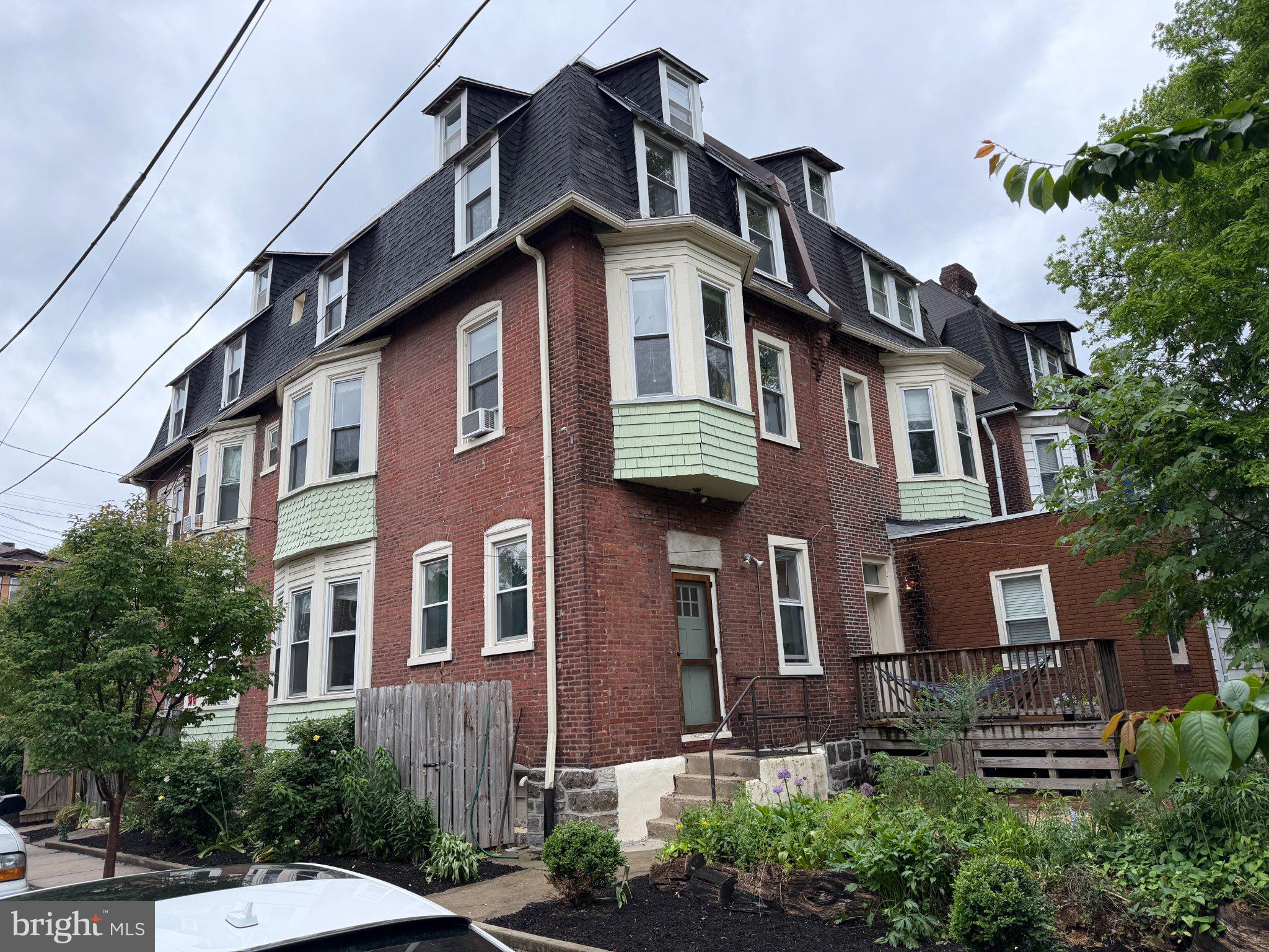 815 South 49th Street Philadelphia, PA 19143 - Photo 55 of 72 a front view of a house with a yard
