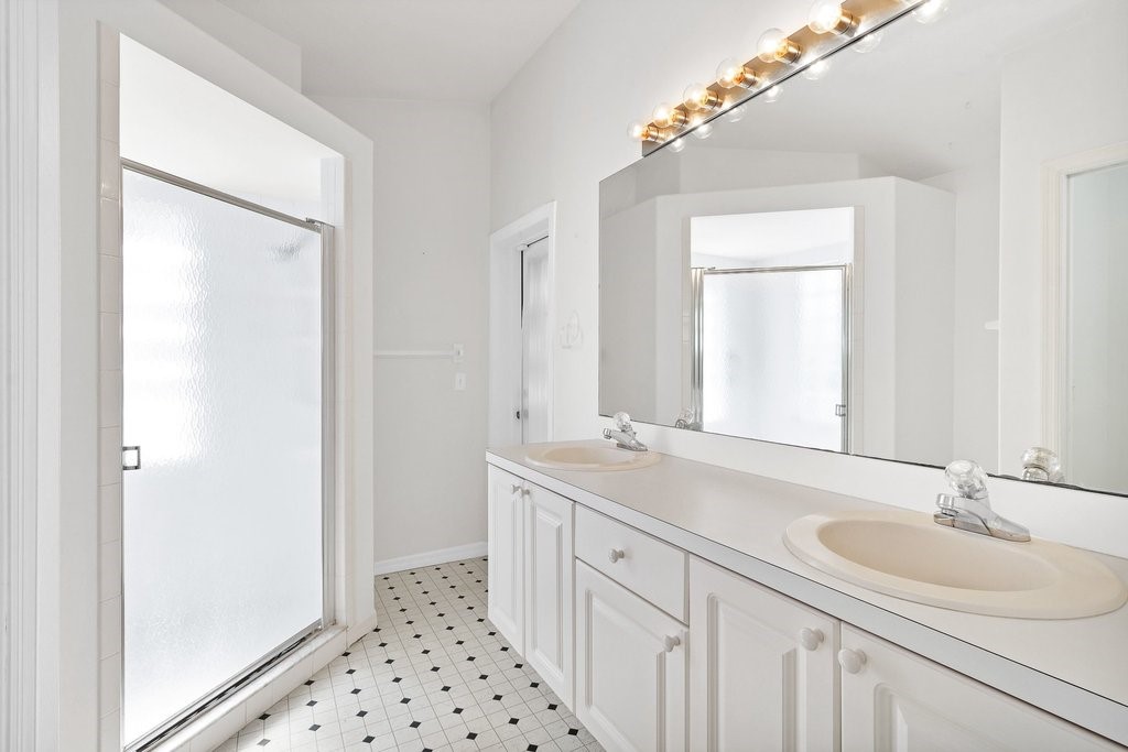 738 Benedictine Terrace Sebastian, FL 32958 - Photo 16 of 33 a bathroom with a sink and a mirror