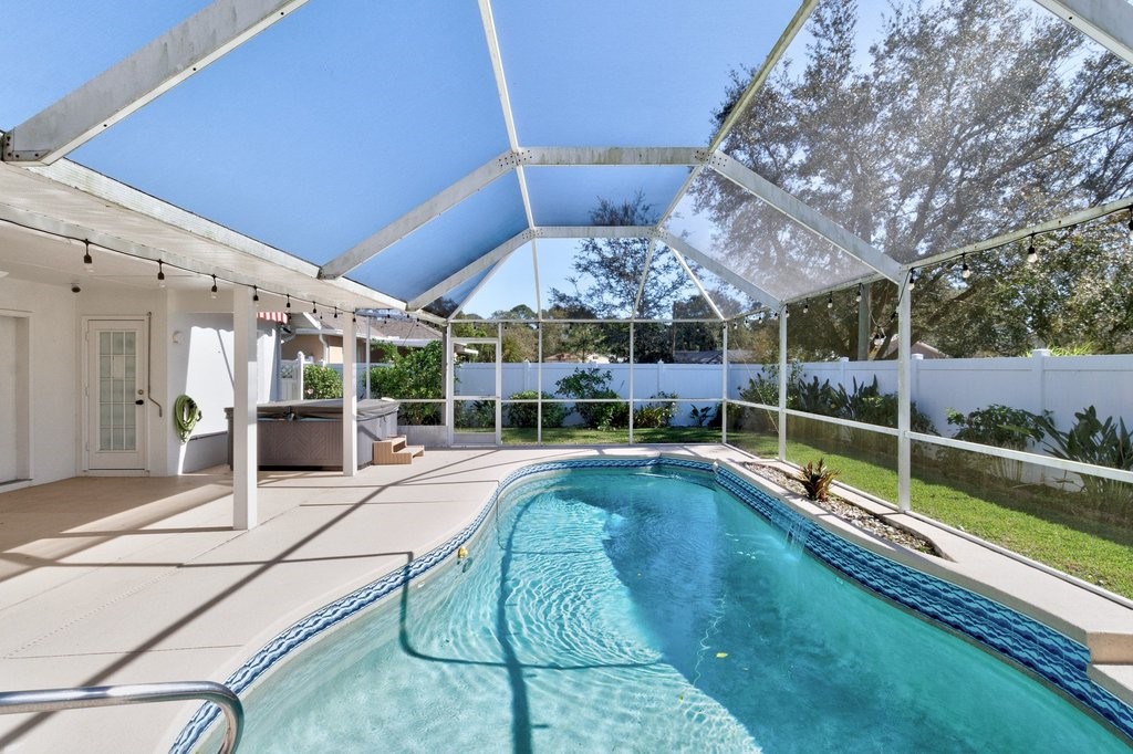 738 Benedictine Terrace Sebastian, FL 32958 - Photo 22 of 33 a view of a backyard with swimming pool