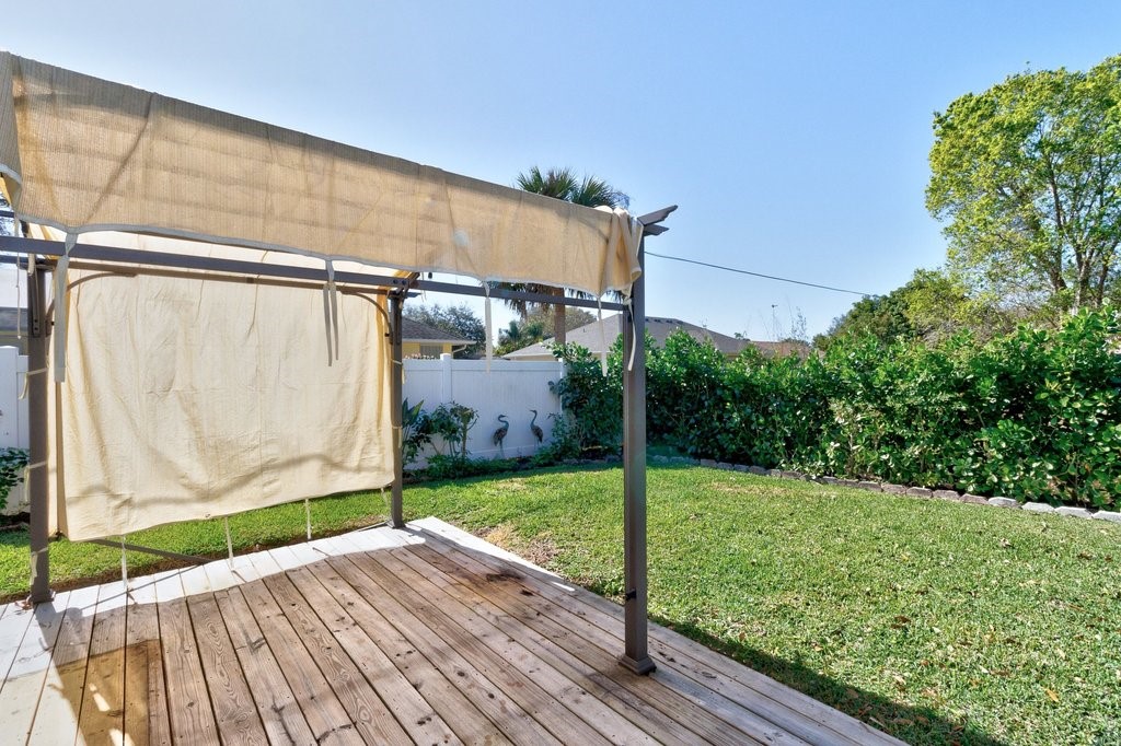 738 Benedictine Terrace Sebastian, FL 32958 - Photo 26 of 33 a view of a backyard with a garden