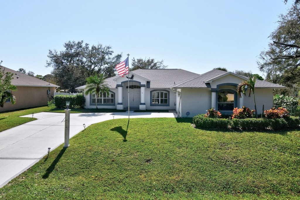 738 Benedictine Terrace Sebastian, FL 32958 - Photo 28 of 33 a front view of a house with garden