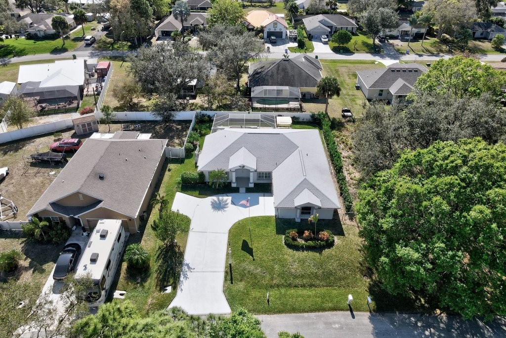 738 Benedictine Terrace Sebastian, FL 32958 - Photo 29 of 33 an aerial view of multiple houses with yard
