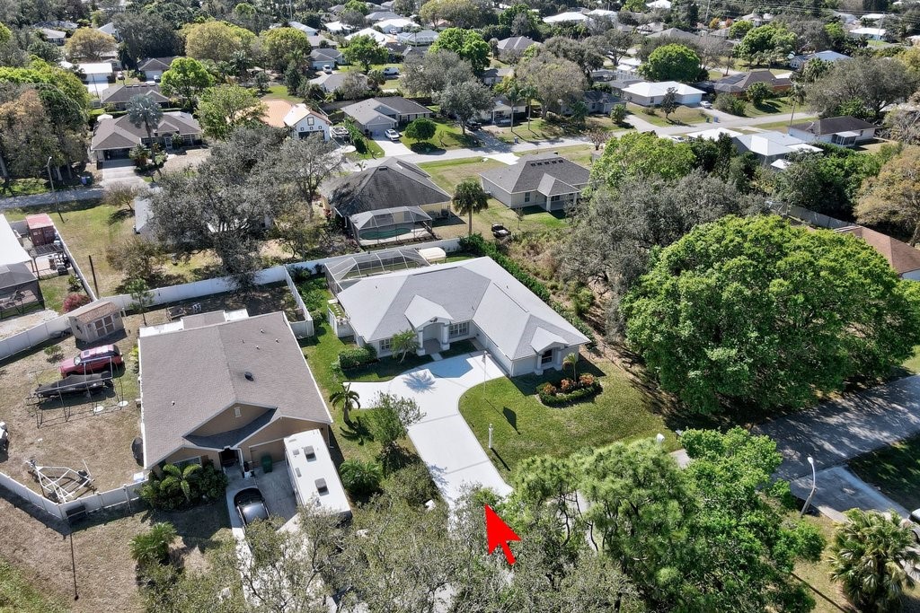 738 Benedictine Terrace Sebastian, FL 32958 - Photo 30 of 33 an aerial view of residential houses with outdoor space and trees